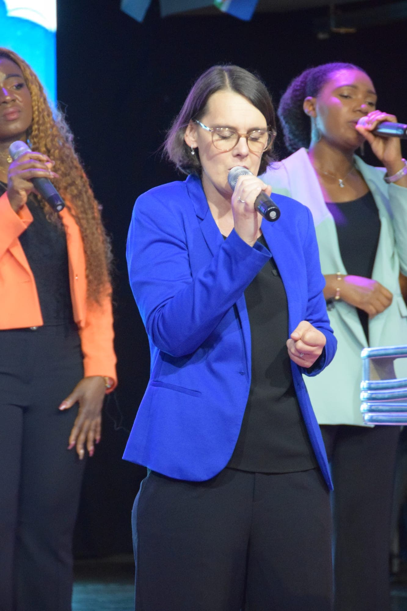 Two women standing together in the sanctuary