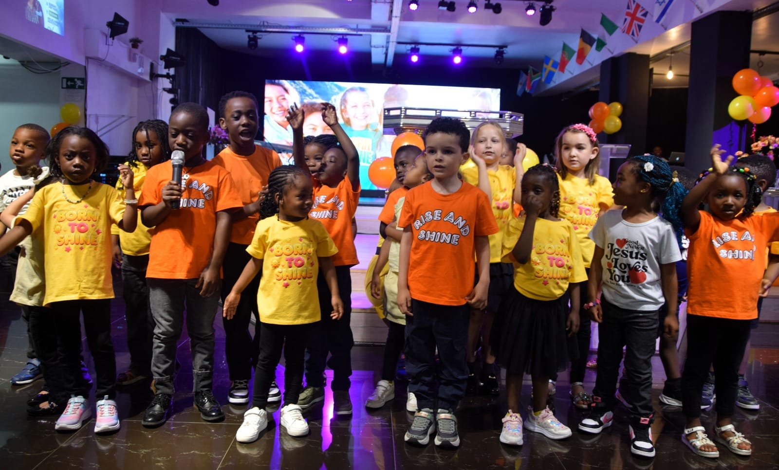 The youngest children singing at the front on Children’s Day