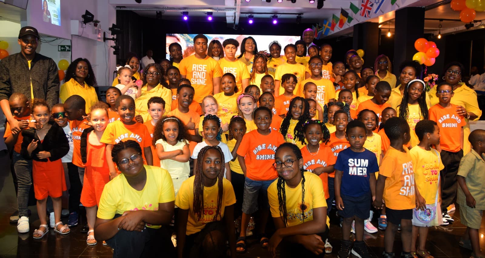 The whole children’s church together in their bright Rise and Shine t-shirts on Children’s Day