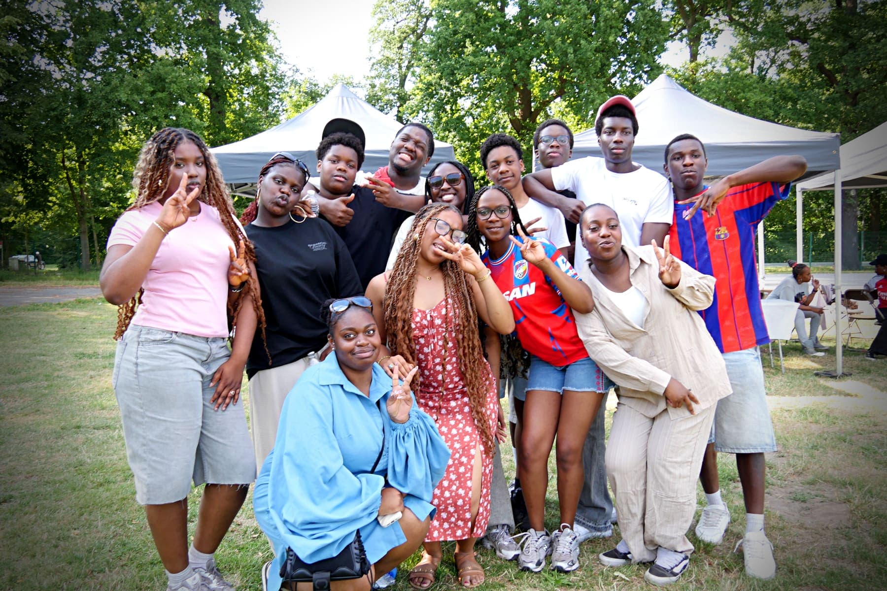 A large group of members posing together at the barbecue