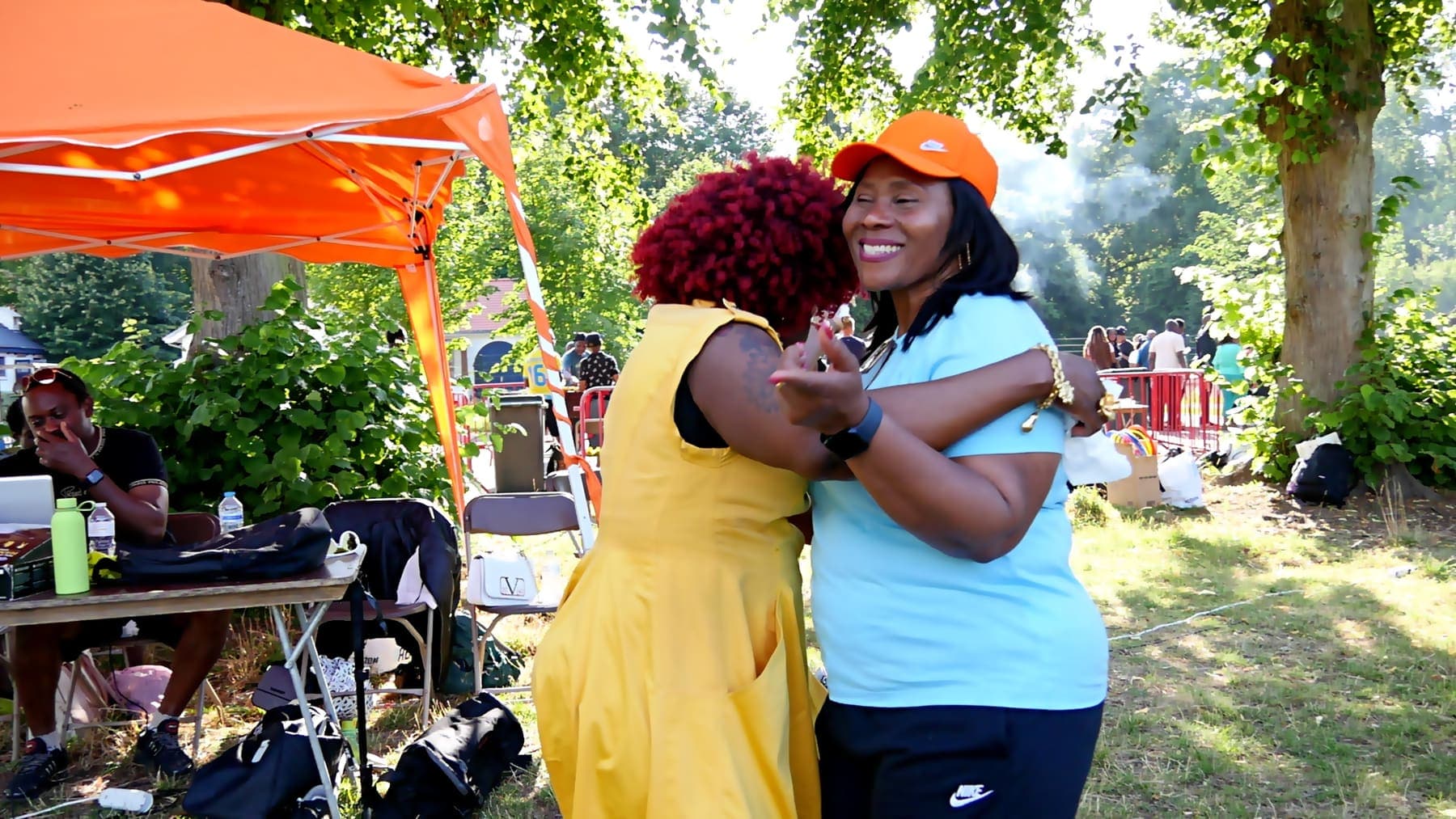 Two members embracing at the church barbecue