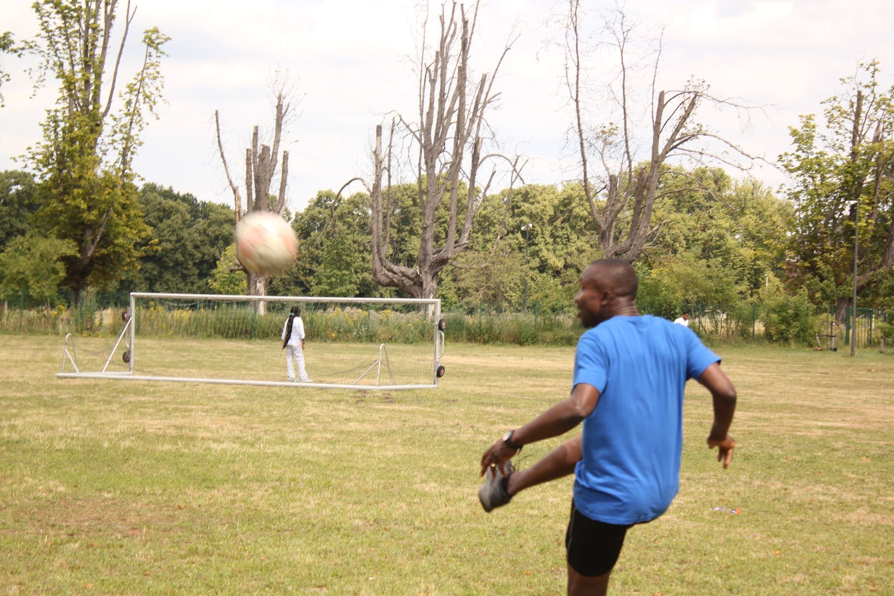 A member shooting at goal during the barbecue football game