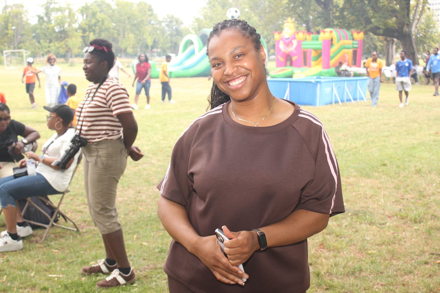 A member standing in the park during the barbecue