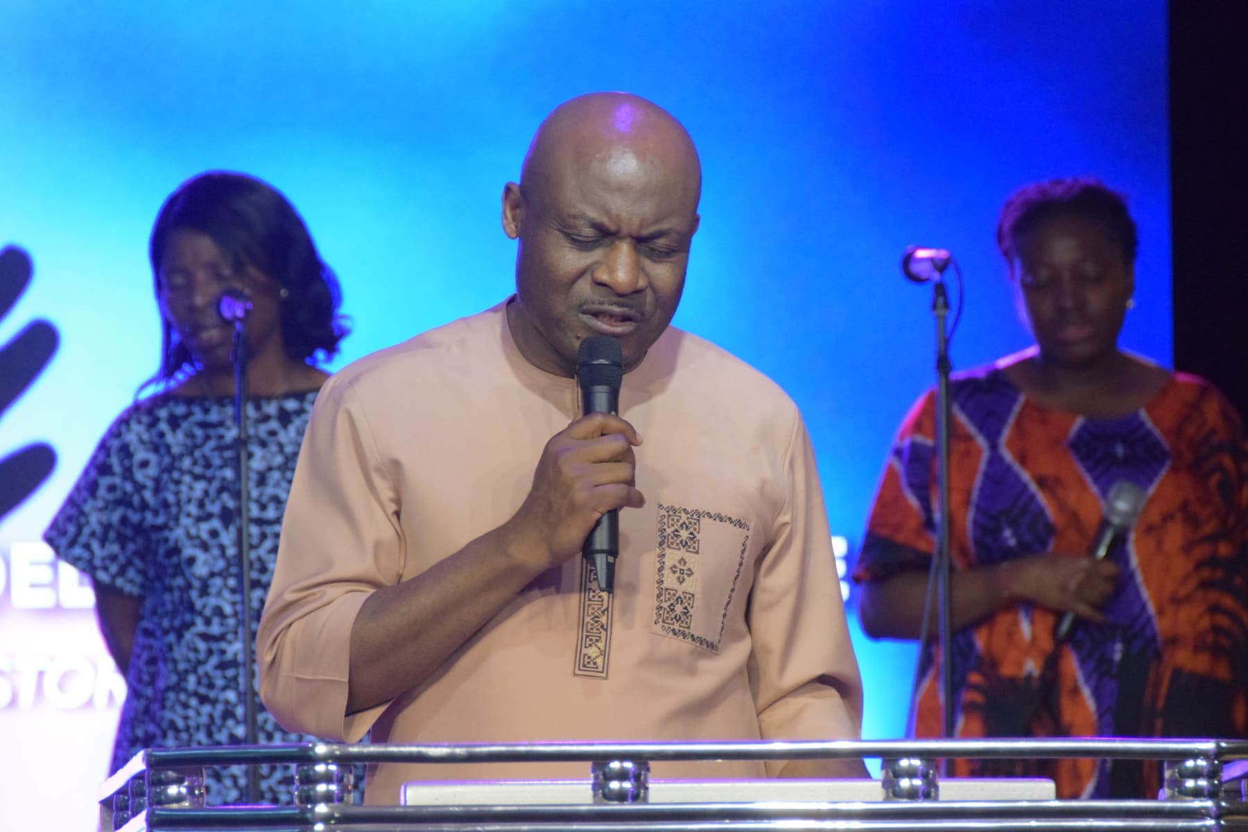 A minister preaching at the podium
