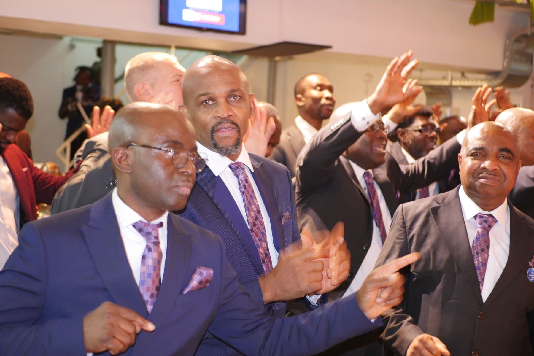 Men worshipping during the Men’s Day service