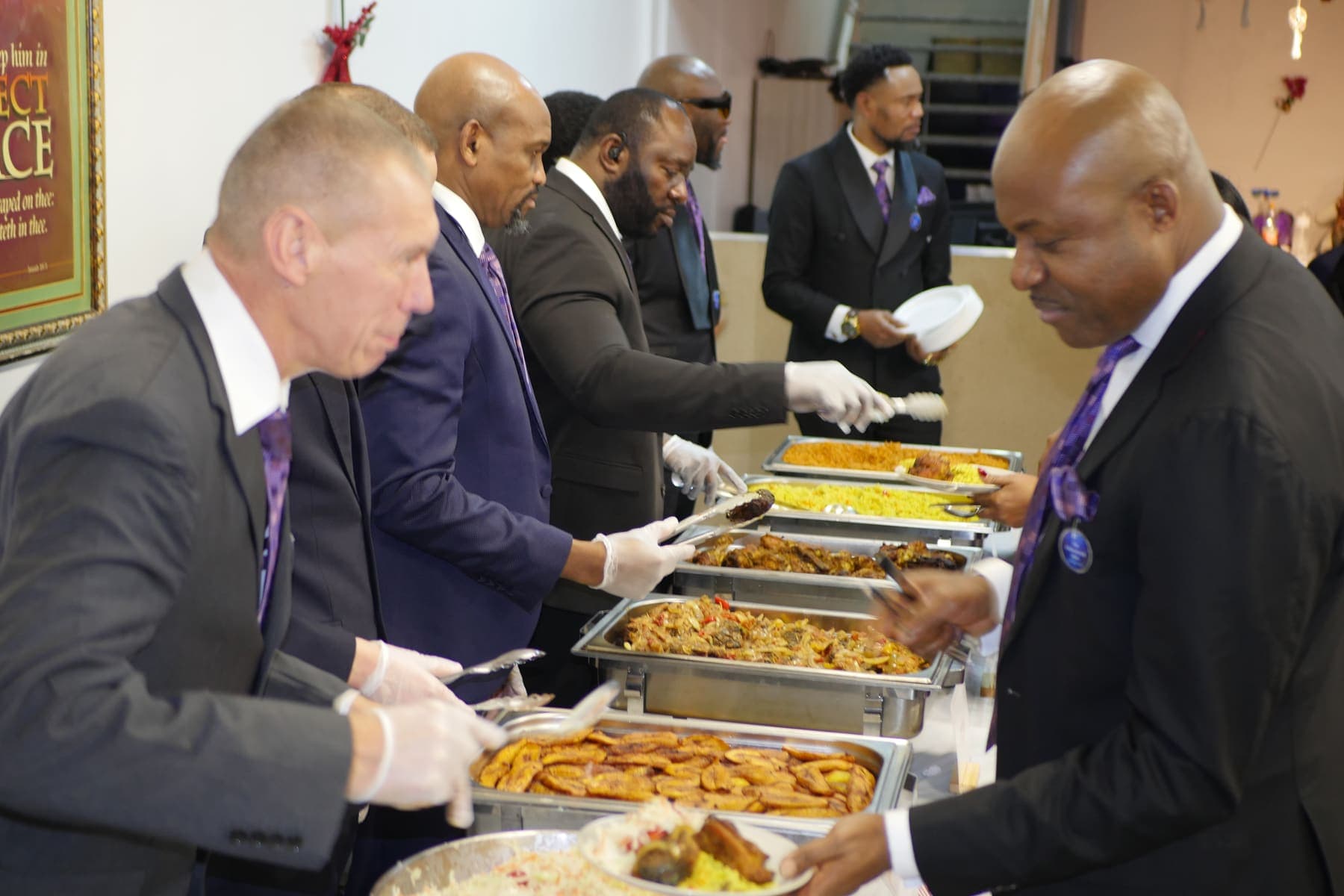 Men serving the meal after the Men’s Day service
