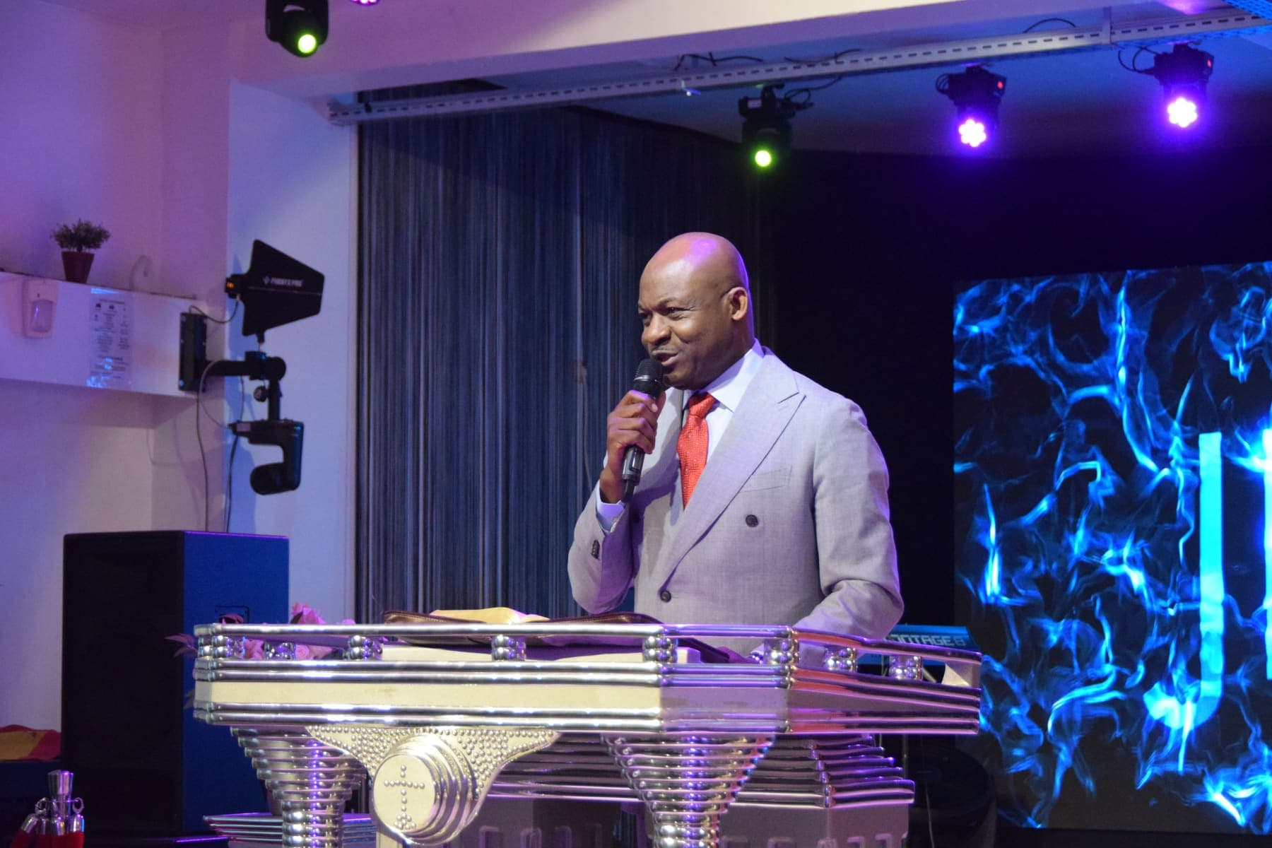 A minister preaching on the platform