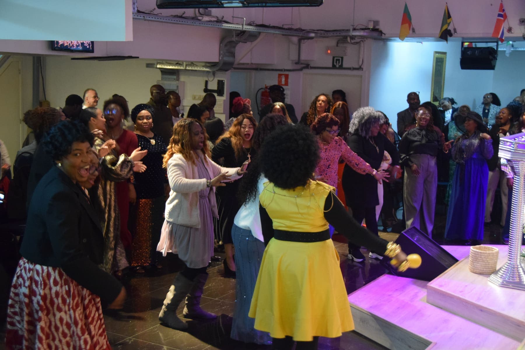 Members dancing in the aisle during the thanksgiving celebration